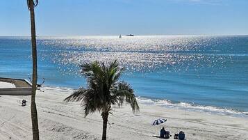 On the beach, sun loungers, beach towels