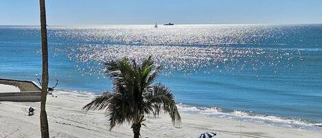 On the beach, sun loungers, beach towels