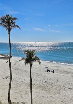 On the beach, sun loungers, beach towels