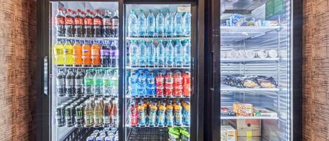 A vending machine with various beverages and snacks.