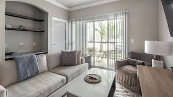 Apartment, 1 Bedroom | Living area | 40-inch TV with digital channels