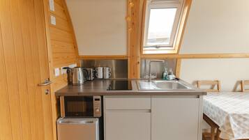 Fridge, microwave, stovetop, coffee/tea maker