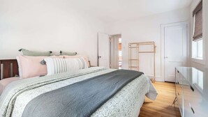 A bedroom with a bed, a wardrobe, and a walk-in closet. - Bright, clean spacious 2 BR apt off street parking (Wilmington)