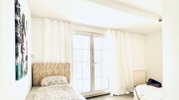 1 bedroom, desk, bed sheets