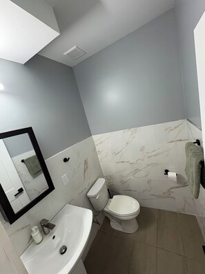 Shower, towels, soap, toilet paper