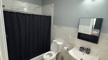 Shower, towels, soap, toilet paper