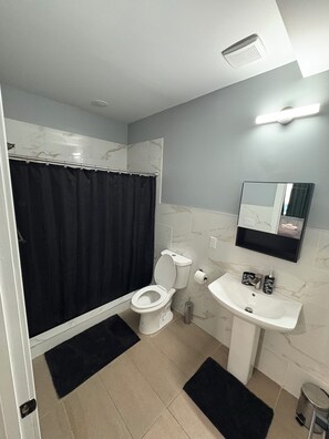 Shower, towels, soap, toilet paper