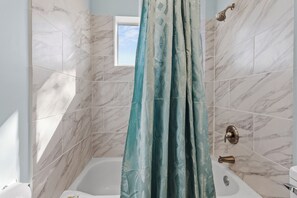 Shower, hair dryer, towels