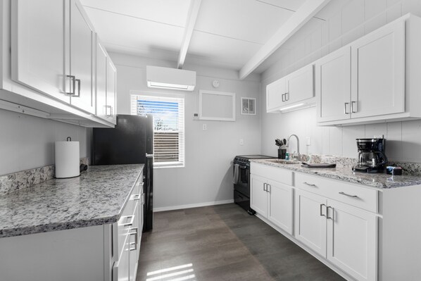 Fridge, microwave, stovetop, coffee/tea maker