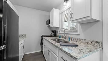 Fridge, microwave, stovetop, coffee/tea maker