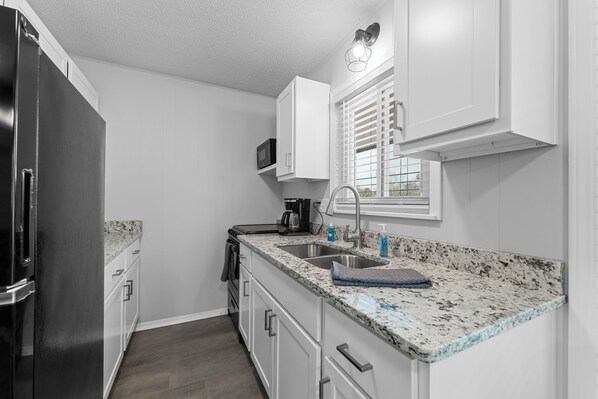 Fridge, microwave, stovetop, coffee/tea maker