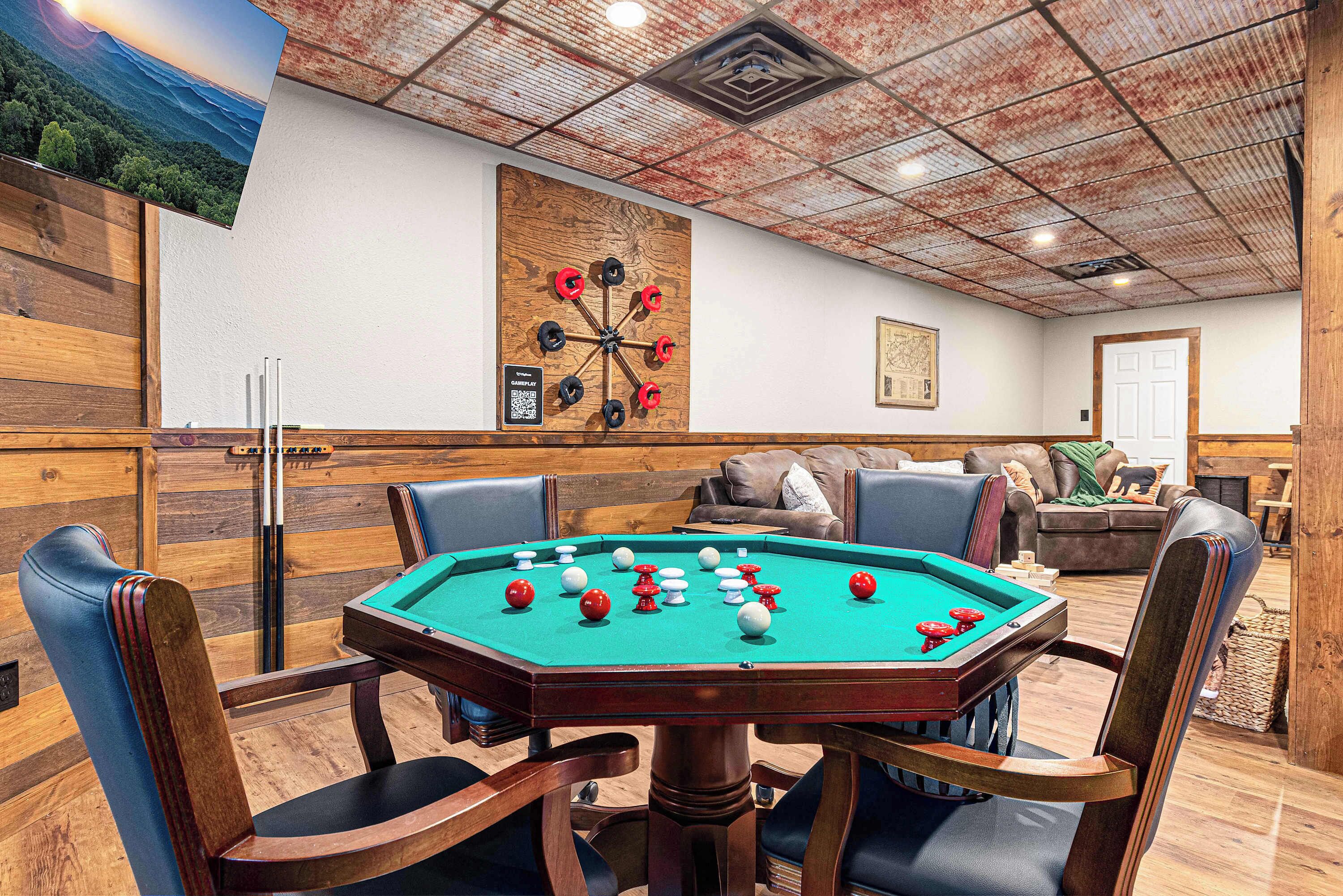 A pool table in a room with wooden walls and a ceiling with a grid pattern.
