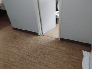 Enter a serene space with a door leading to an area.