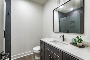 Shower, hair dryer, towels, shampoo