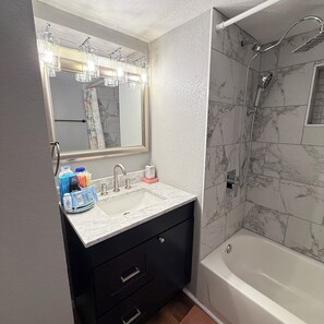 Shower, towels, soap, shampoo - Newly updated home on Spruce St (Mason)