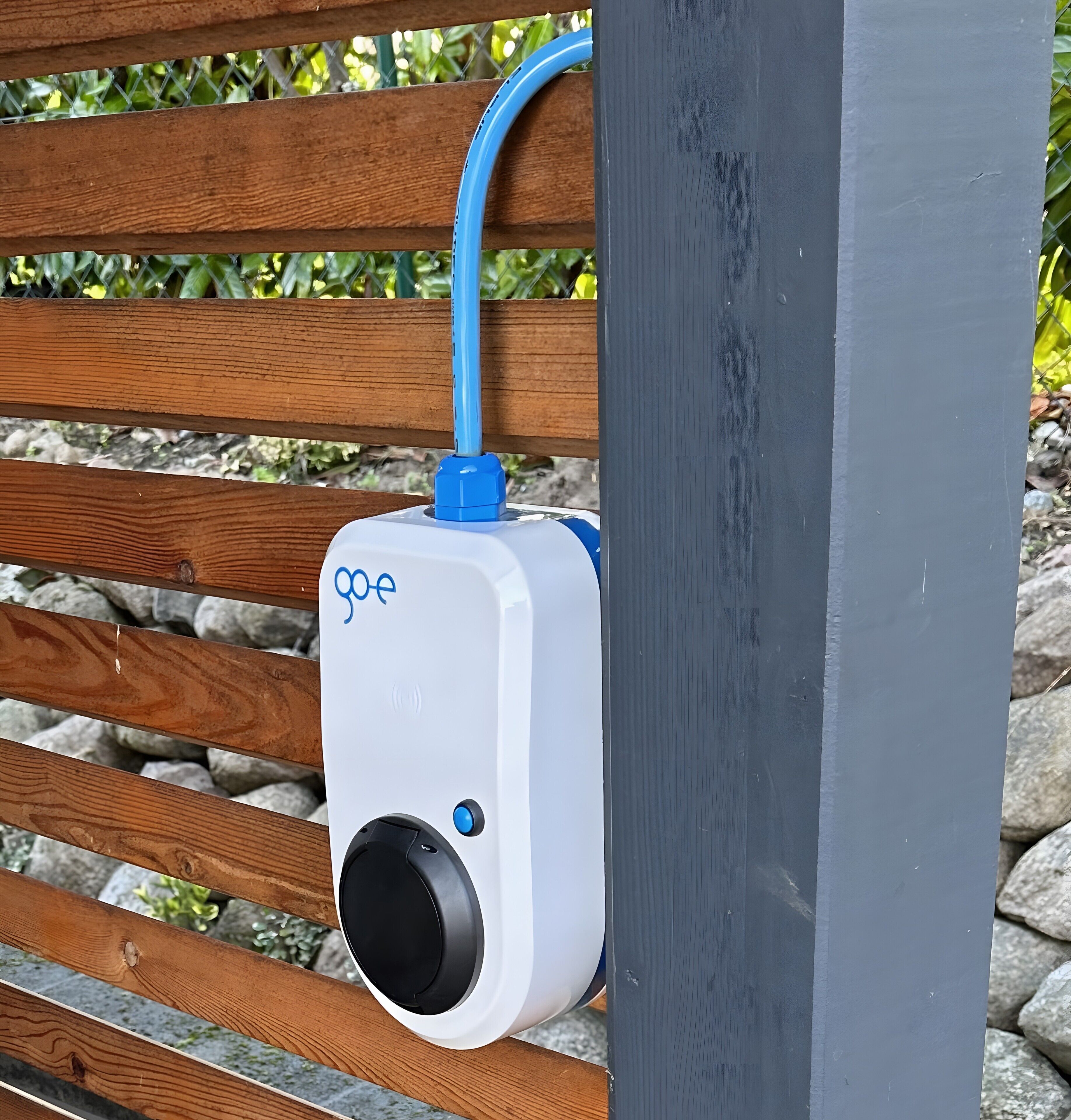 A GoPro camera mounted on a wooden bench.