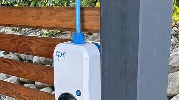A GoPro camera mounted on a wooden bench.