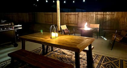 Charming 4-bedroom house with movie room, game room, outdoor patio + fire pit