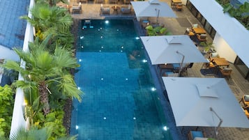 Outdoor pool, open 6:30 AM to 7:00 PM, pool umbrellas, pool loungers