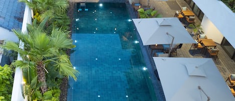 Outdoor pool, open 6:30 AM to 7:00 PM, pool umbrellas, sun loungers