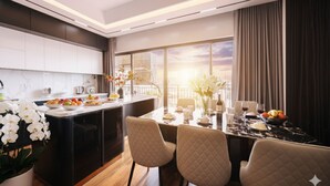 A modern kitchen with a dining area, featuring a large window with a city view, a marble countertop, and a table set for dining. - Crescendo Unique Studio (Hanoi)