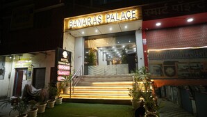 Hotel Banaras Palace with a signboard, a staircase leading to the entrance, and potted plants in the foreground. - Hotel Banaras Palace (Varanasi)