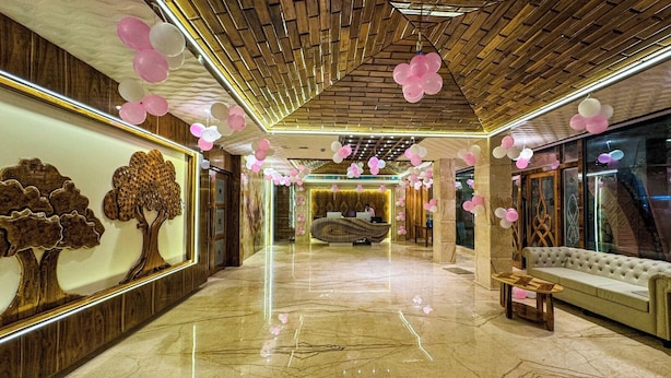A spacious lobby with a marble floor, a reception desk, and a sofa. - Daltin Tower Digha (Kanthi)