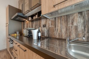 Fridge, microwave, stovetop, coffee/tea maker