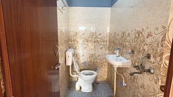 Shower, rainfall showerhead, slippers, towels