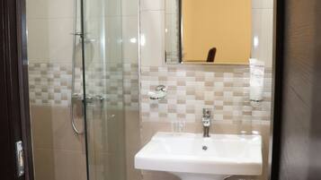 Economy Suite | Bathroom | Bathrobes, slippers