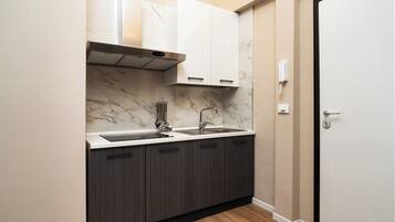 Suite Deluks, pemandangan kota | Area keluarga | TV