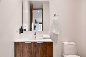 Shower, hair dryer, towels, shampoo