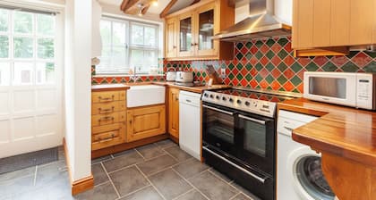 Dog-friendly cottage in charming village, with country walks and close to coast