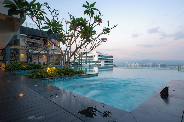 Seasonal outdoor pool, open 7:00 AM to 10:00 PM, sun loungers