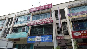 A building with multiple signs, including 'Hotel 609' and 'Rumah Tumpangan Hotel Sixty Nine'. - Hotel Sixty Nine (Johor Bahru)