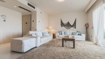 Villa | Living area | 35-inch TV with digital channels