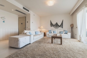 Villa | Living area | 35-inch TV with digital channels