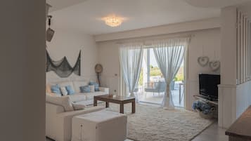 Villa | Living area | 35-inch TV with digital channels