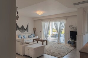 Villa | Living area | 35-inch TV with digital channels