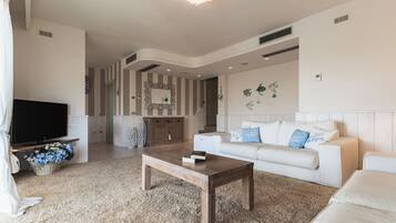 Villa | Living area | 35-inch TV with digital channels