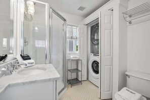 Shower, hair dryer, towels, shampoo