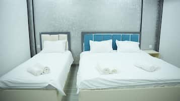 Family Triple Room, Courtyard View | Desk, laptop workspace, soundproofing, free WiFi