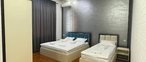 Family Triple Room, Courtyard View | Desk, laptop workspace, soundproofing, free WiFi