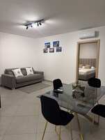 Deluxe Condo | Living area | TV