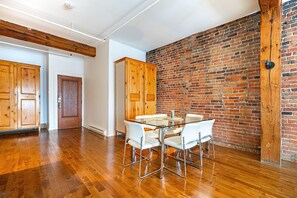 Enjoy dining and socializing in this functional space with a glass-top table and four chairs.