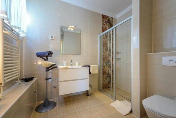 Shower, hair dryer, towels, soap