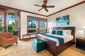 A bedroom with a bed, a chair, a bench, a ceiling fan, and a painting.