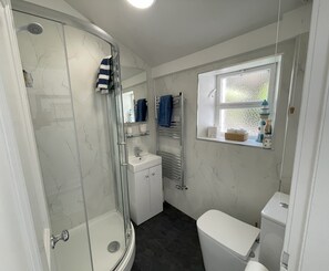 Shower, hair dryer, towels, soap