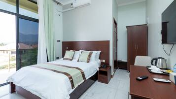 Deluxe Double Room, City View | Desk, laptop workspace, cribs/infant beds, free WiFi