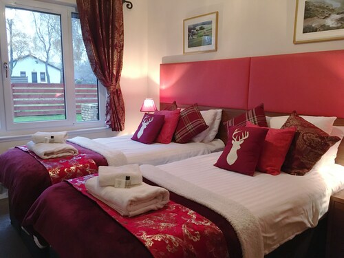 The Eagle sleeps 8-10 with log burning stove, sauna, BBQ and enclosed garden.